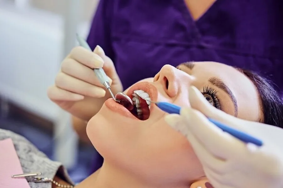 Dentist examining a patient’s teeth